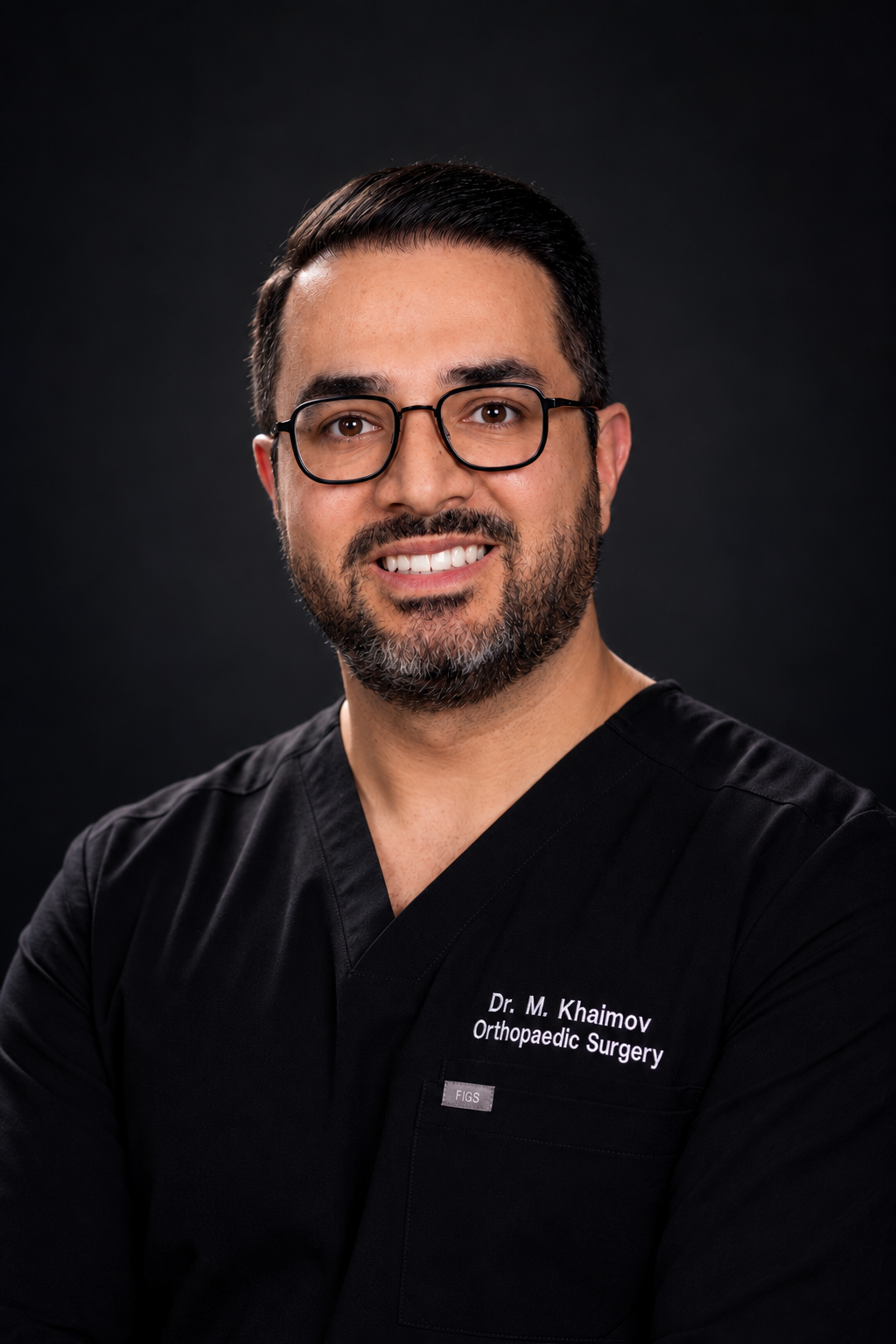 Dr. Mikhail Khaimov wearing black surgical scrubs
